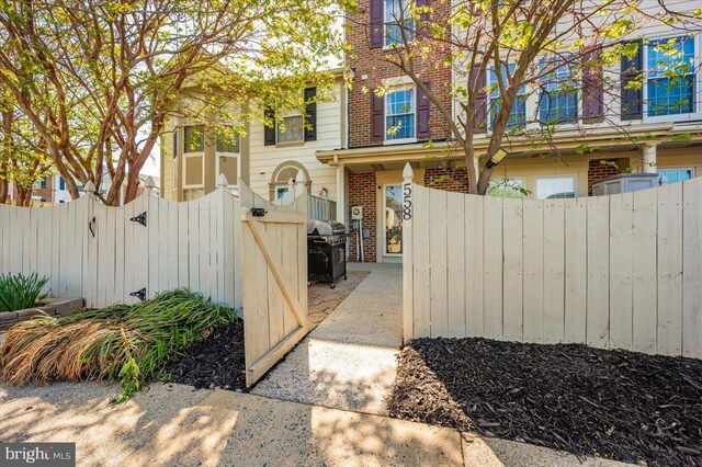 558 Hollyberry Way, Frederick, MD 21703 - view of home's exterior with a gate, fence private yard, and brick siding