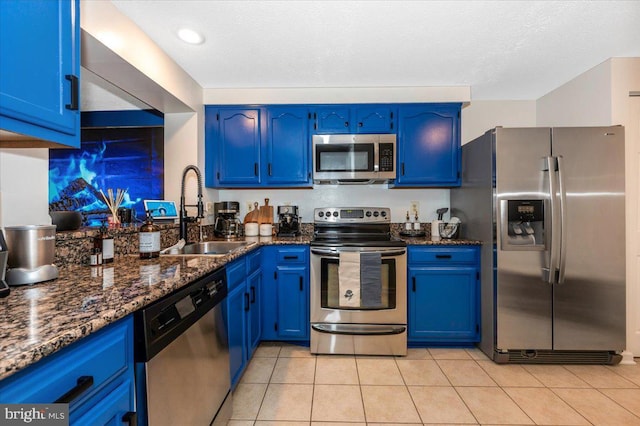558 Hollyberry Way, Frederick, MD 21703 - kitchen with a sink, dark stone countertops, stainless steel appliances, and blue cabinetry