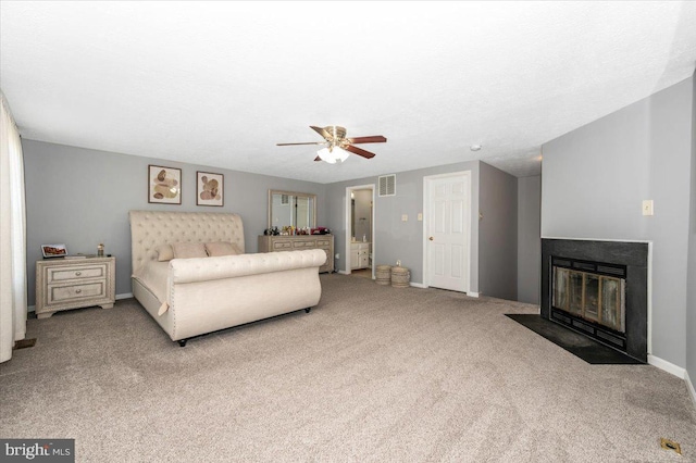 558 Hollyberry Way, Frederick, MD 21703 - carpeted bedroom featuring visible vents, a fireplace with flush hearth, baseboards, and ceiling fan