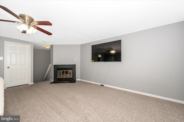 558 Hollyberry Way, Frederick, MD 21703 - unfurnished living room with carpet floors, a fireplace with flush hearth, baseboards, and ceiling fan