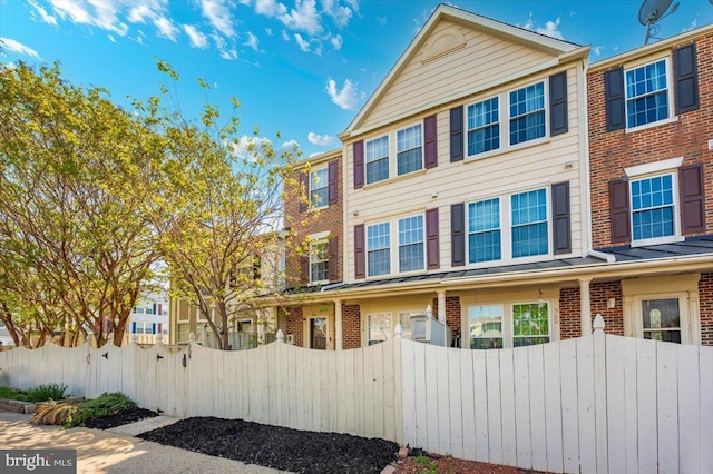 558 Hollyberry Way, Frederick, MD 21703 - multi unit property with brick siding and a fenced front yard