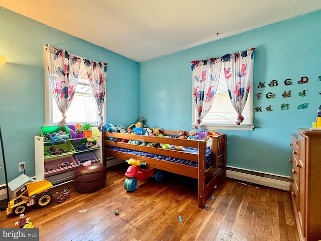 436 Norway Ave, Hamilton, NJ 08629 - bedroom with hardwood / wood-style flooring, a baseboard heating unit, and multiple windows