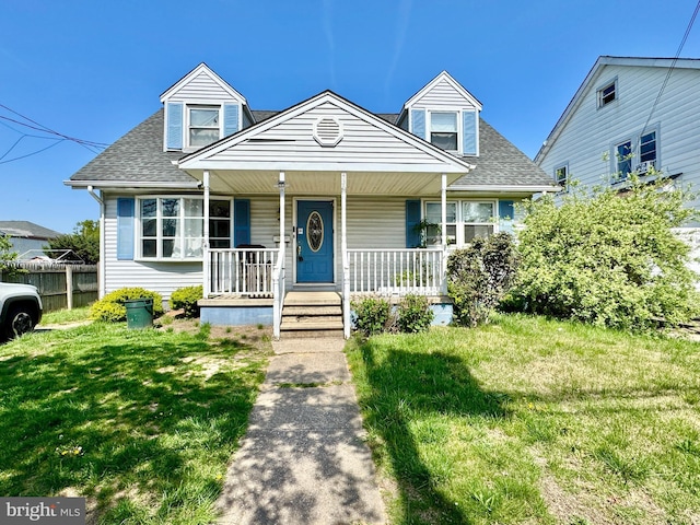 436 Norway Ave, Hamilton, NJ 08629 - cape cod-style house featuring a front yard, fence, covered porch, and roof with shingles