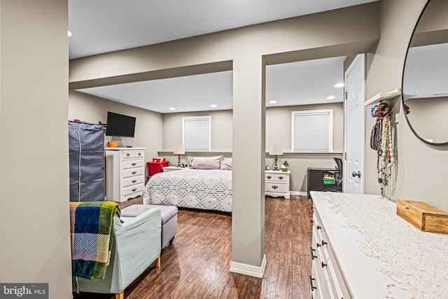 bedroom featuring recessed lighting and dark wood-type flooring