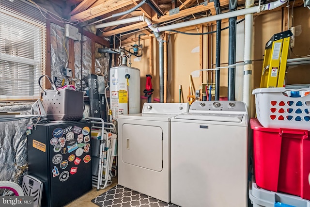 laundry area featuring laundry area, gas water heater, and washer and dryer