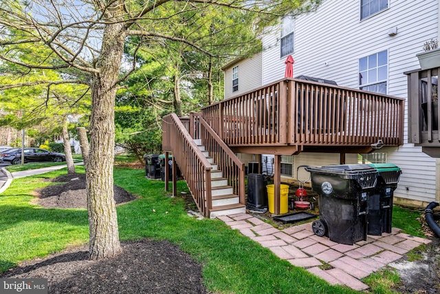 view of yard featuring stairway and a deck