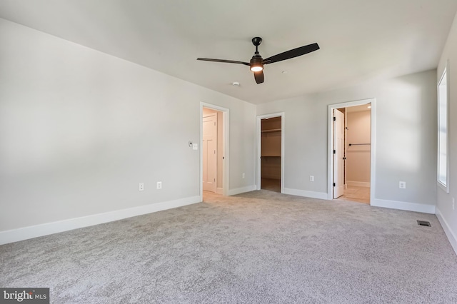 3519 Cedar Dr, Edgewater, MD 21037 - unfurnished bedroom with baseboards, a spacious closet, light carpet, and visible vents