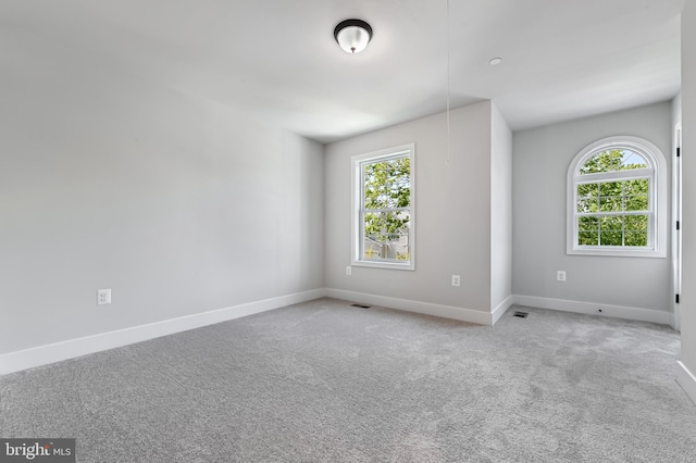 3519 Cedar Dr, Edgewater, MD 21037 - carpeted empty room featuring baseboards, visible vents, and a wealth of natural light
