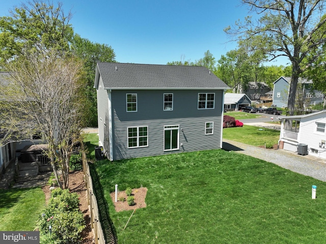 3519 Cedar Dr, Edgewater, MD 21037 - rear view of house featuring a yard and central AC