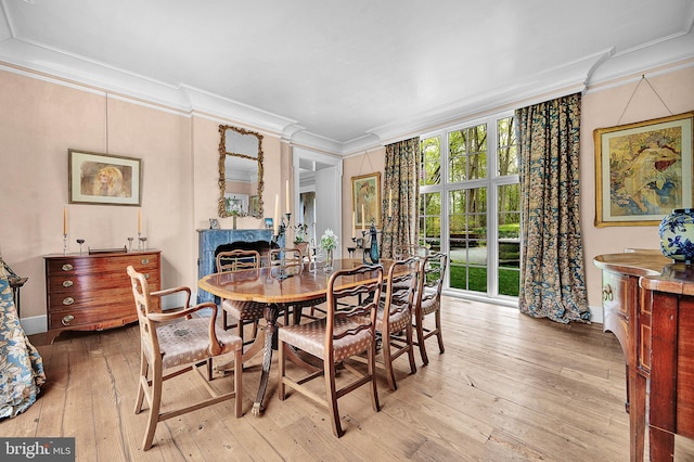 227 Jackson Rd, Cochranville, PA 19330 - dining room with ornamental molding, light wood-style flooring, baseboards, and a fireplace