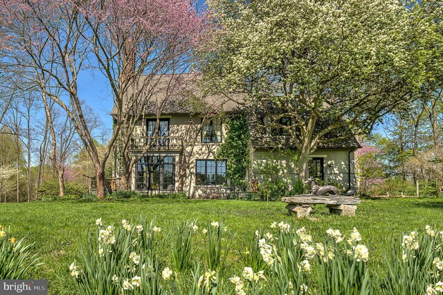 227 Jackson Rd, Cochranville, PA 19330 - rear view of property with a balcony, a lawn, and stucco siding