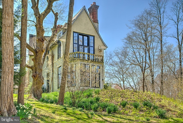 227 Jackson Rd, Cochranville, PA 19330 - view of side of home featuring stucco siding and a chimney