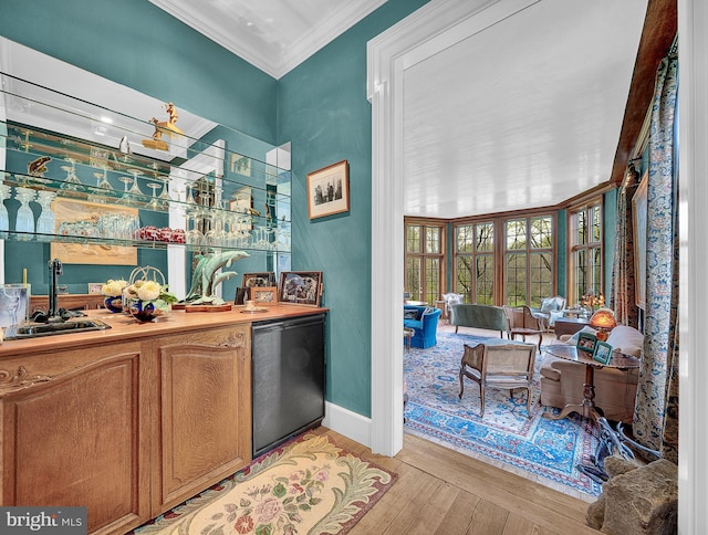 227 Jackson Rd, Cochranville, PA 19330 - indoor wet bar with refrigerator, ornamental molding, light wood finished floors, and baseboards