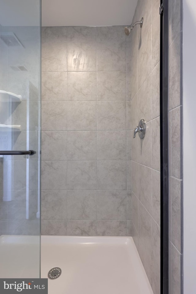full bathroom featuring a shower stall