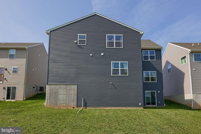 back of property with a yard