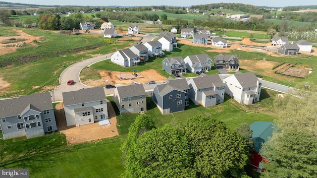birds eye view of property with a residential view