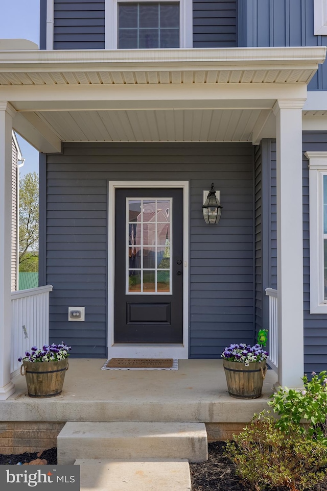 property entrance featuring covered porch