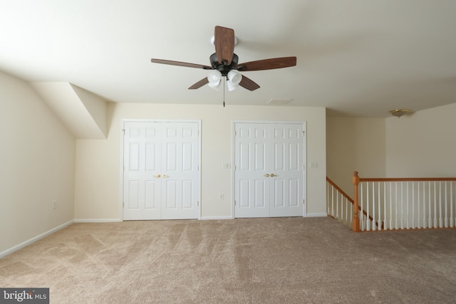bonus room with baseboards, carpet floors, and ceiling fan