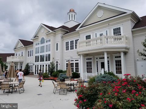 rear view of property featuring a balcony