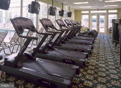 workout area featuring carpet floors and french doors