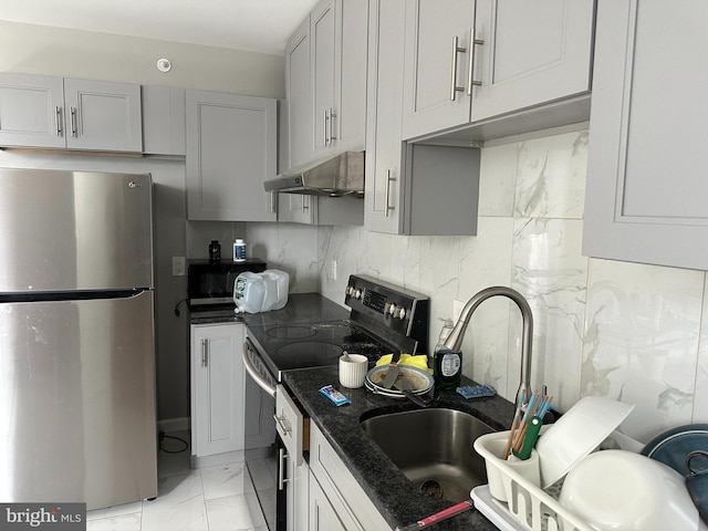 2108 Ridge Ave, Philadelphia, PA 19121 - kitchen featuring a sink, decorative backsplash, marble finish floor, appliances with stainless steel finishes, and under cabinet range hood