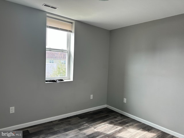 2108 Ridge Ave, Philadelphia, PA 19121 - spare room featuring visible vents, baseboards, and dark wood-style flooring