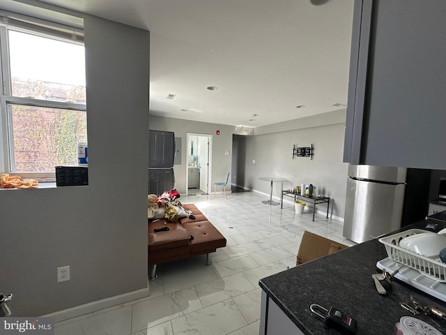 2108 Ridge Ave, Philadelphia, PA 19121 - interior space featuring dark countertops, freestanding refrigerator, baseboards, recessed lighting, and marble finish floor
