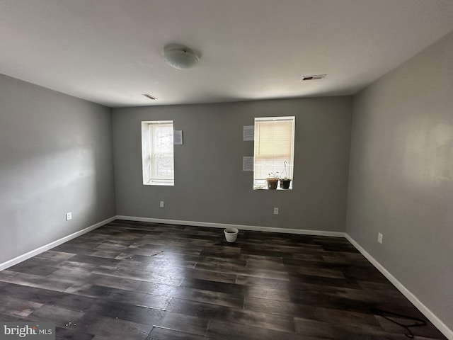 2108 Ridge Ave, Philadelphia, PA 19121 - empty room featuring baseboards, visible vents, and dark wood finished floors