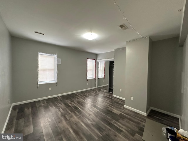 2108 Ridge Ave, Philadelphia, PA 19121 - unfurnished room featuring baseboards, dark wood-style flooring, and visible vents