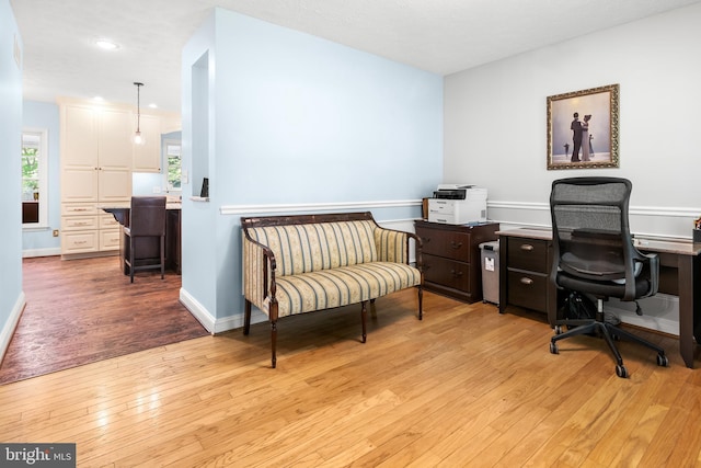 home office with recessed lighting, baseboards, and light wood-type flooring