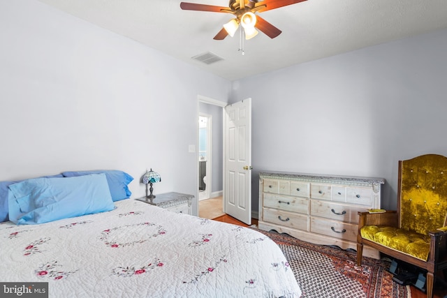 bedroom with a ceiling fan and visible vents