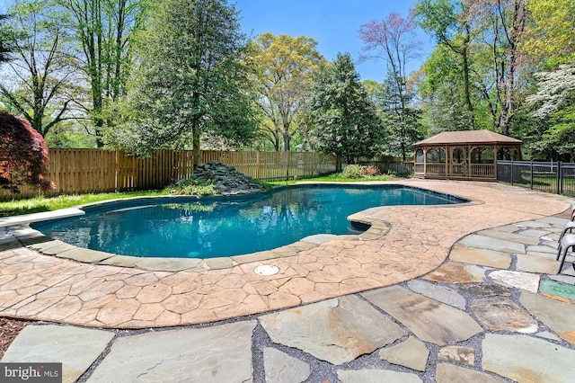 view of pool featuring a patio, a gazebo, a fenced in pool, and a fenced backyard