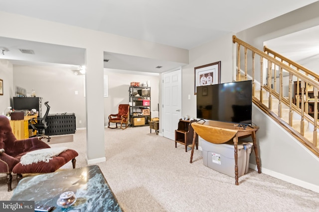 living room featuring stairway, visible vents, baseboards, and carpet