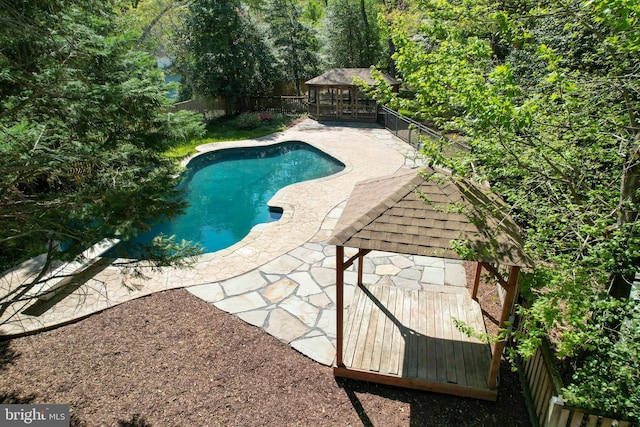 view of swimming pool with a gazebo, a fenced in pool, a fenced backyard, and a patio area