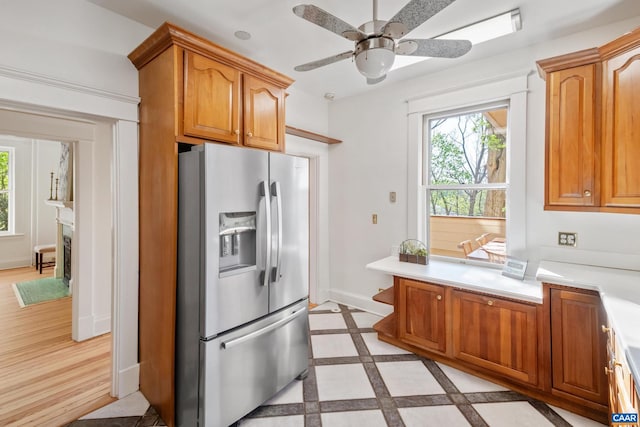 410 Altamont Cir, Charlottesville, VA 22902 - kitchen with baseboards, a ceiling fan, stainless steel fridge, and light countertops