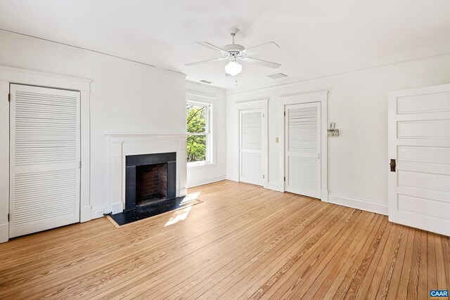 410 Altamont Cir, Charlottesville, VA 22902 - unfurnished living room featuring light wood-type flooring, ceiling fan, a fireplace, baseboards, and visible vents