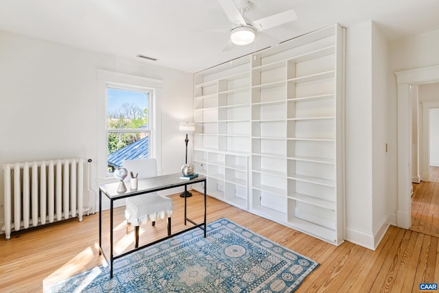 410 Altamont Cir, Charlottesville, VA 22902 - unfurnished office with ceiling fan, visible vents, radiator heating unit, baseboards, and wood finished floors