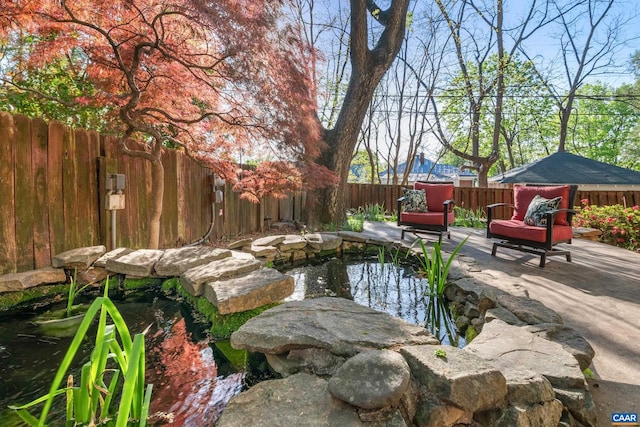 410 Altamont Cir, Charlottesville, VA 22902 - view of swimming pool featuring a garden pond, a fenced backyard, and a patio area
