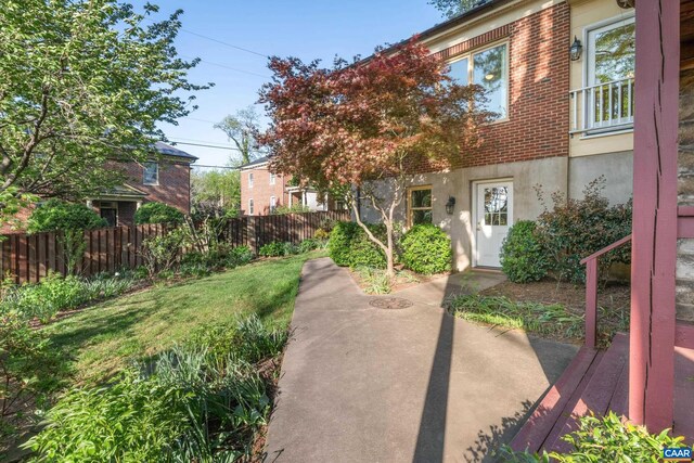 410 Altamont Cir, Charlottesville, VA 22902 - exterior space with brick siding, fence, and a yard