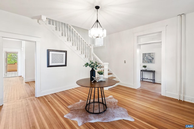 410 Altamont Cir, Charlottesville, VA 22902 - entryway featuring an inviting chandelier, stairway, light wood-style floors, and baseboards