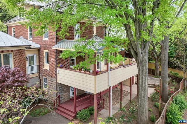 410 Altamont Cir, Charlottesville, VA 22902 - rear view of property featuring a standing seam roof, brick siding, and metal roof