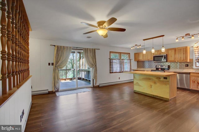 kitchen with dark wood-style floors, a ceiling fan, appliances with stainless steel finishes, and a baseboard radiator