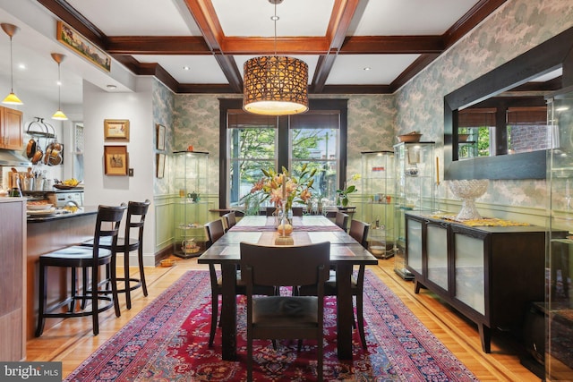 dining space featuring beamed ceiling, wallpapered walls, crown molding, and coffered ceiling