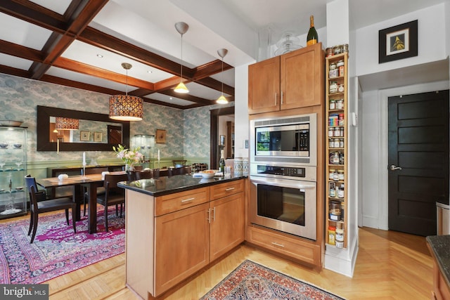 kitchen featuring wainscoting, stainless steel appliances, wallpapered walls, a peninsula, and coffered ceiling