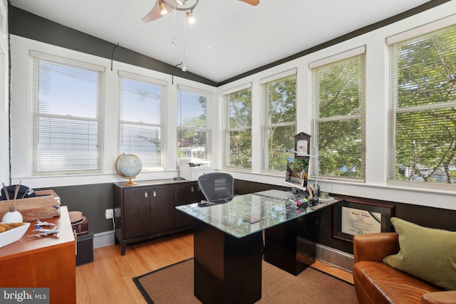 office with a ceiling fan, vaulted ceiling, a wealth of natural light, and light wood-style flooring