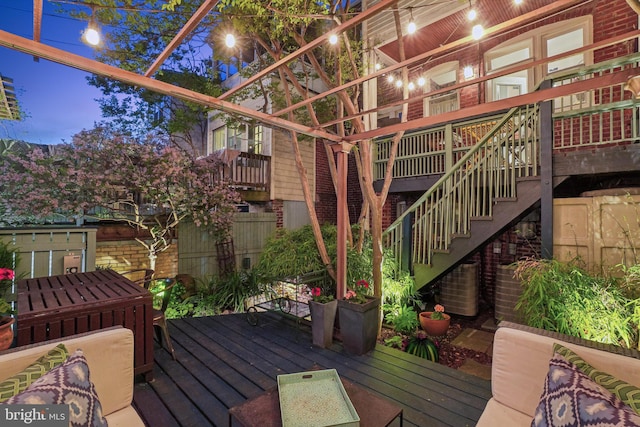 wooden deck featuring stairway