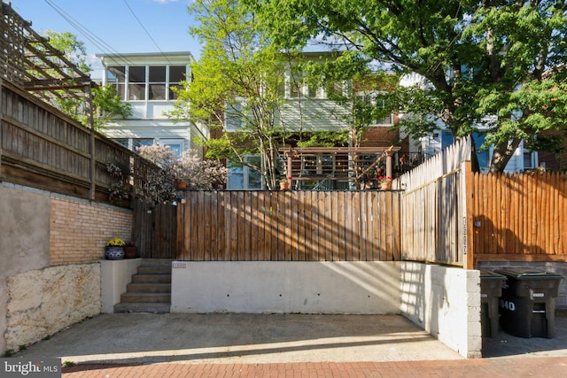 view of gate with fence