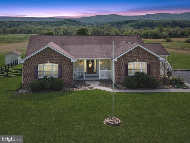 2004 State Road 259 N, Wardensville, WV 26851 - view of front of property with a porch, brick siding, and a mountain view