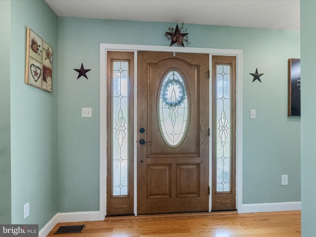 2004 State Road 259 N, Wardensville, WV 26851 - foyer entrance featuring baseboards, wood finished floors, and visible vents