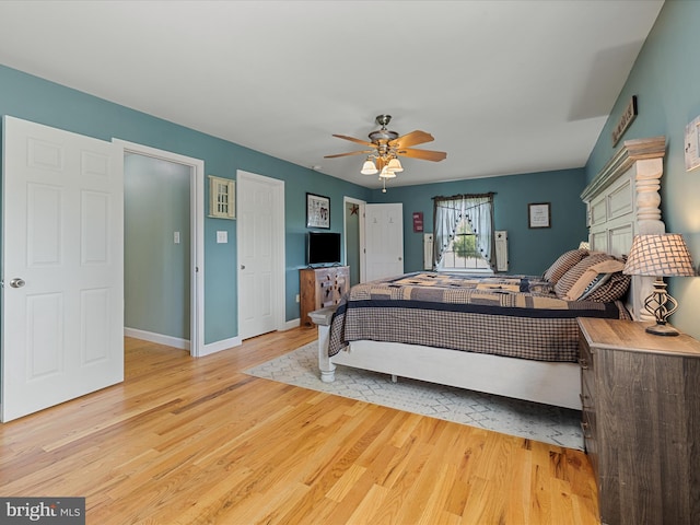 2004 State Road 259 N, Wardensville, WV 26851 - bedroom with a ceiling fan, baseboards, and light wood-type flooring